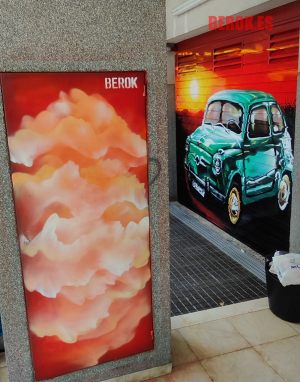pintura mural nubes rojas naranjas parking